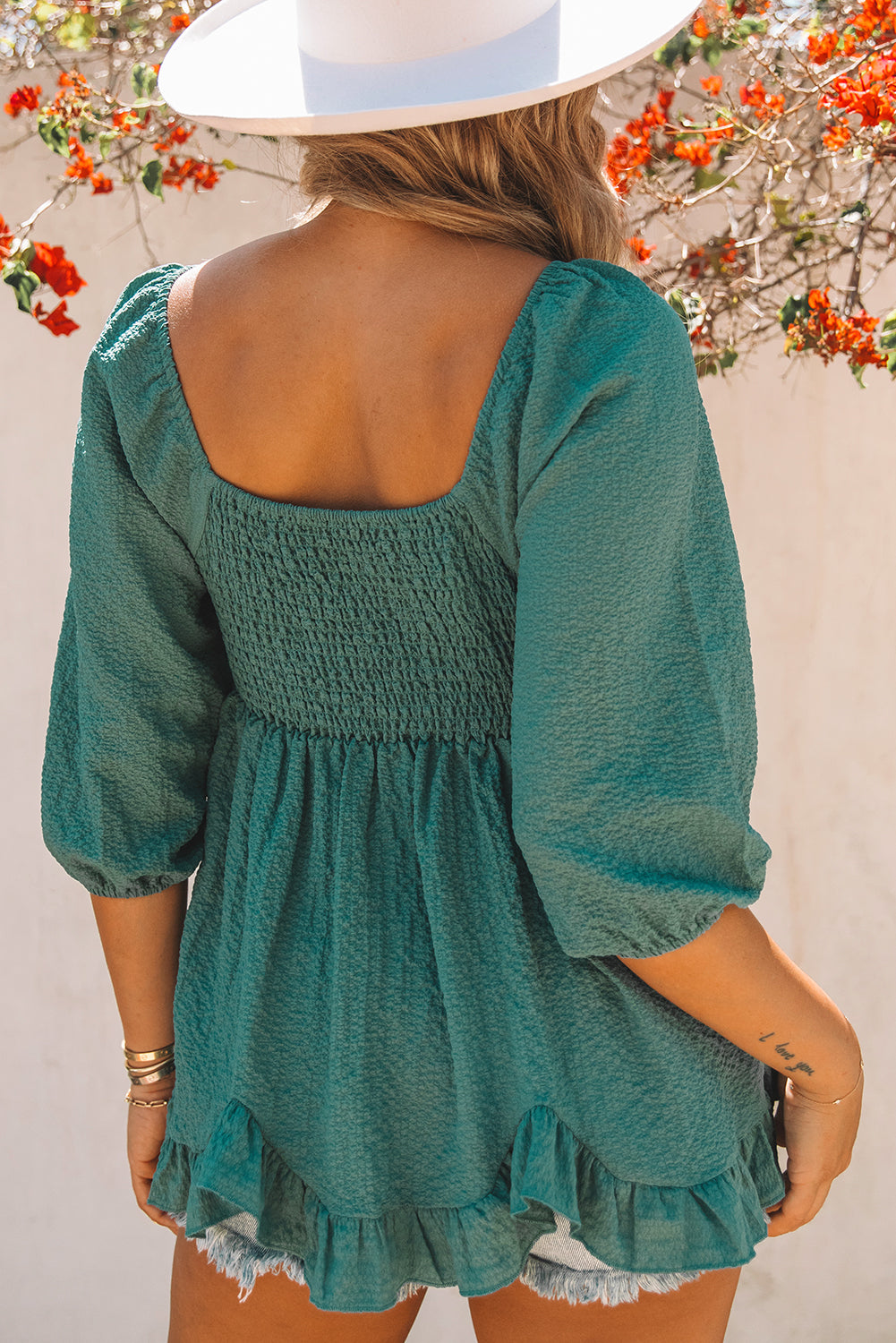 Smocked Three-Quarter Sleeve Peplum Blouse